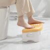 Foldable foot rest with rollers