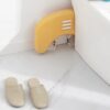 Foldable foot rest with rollers